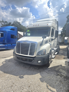2019 Freightliner Cascadia midroof sleeper cab tractor showing front grille, headlights, and side mirrors.