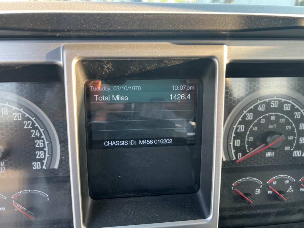 Dashboard display showing Total Miles 1426.4 on a Mack MD6 truck instrument cluster.