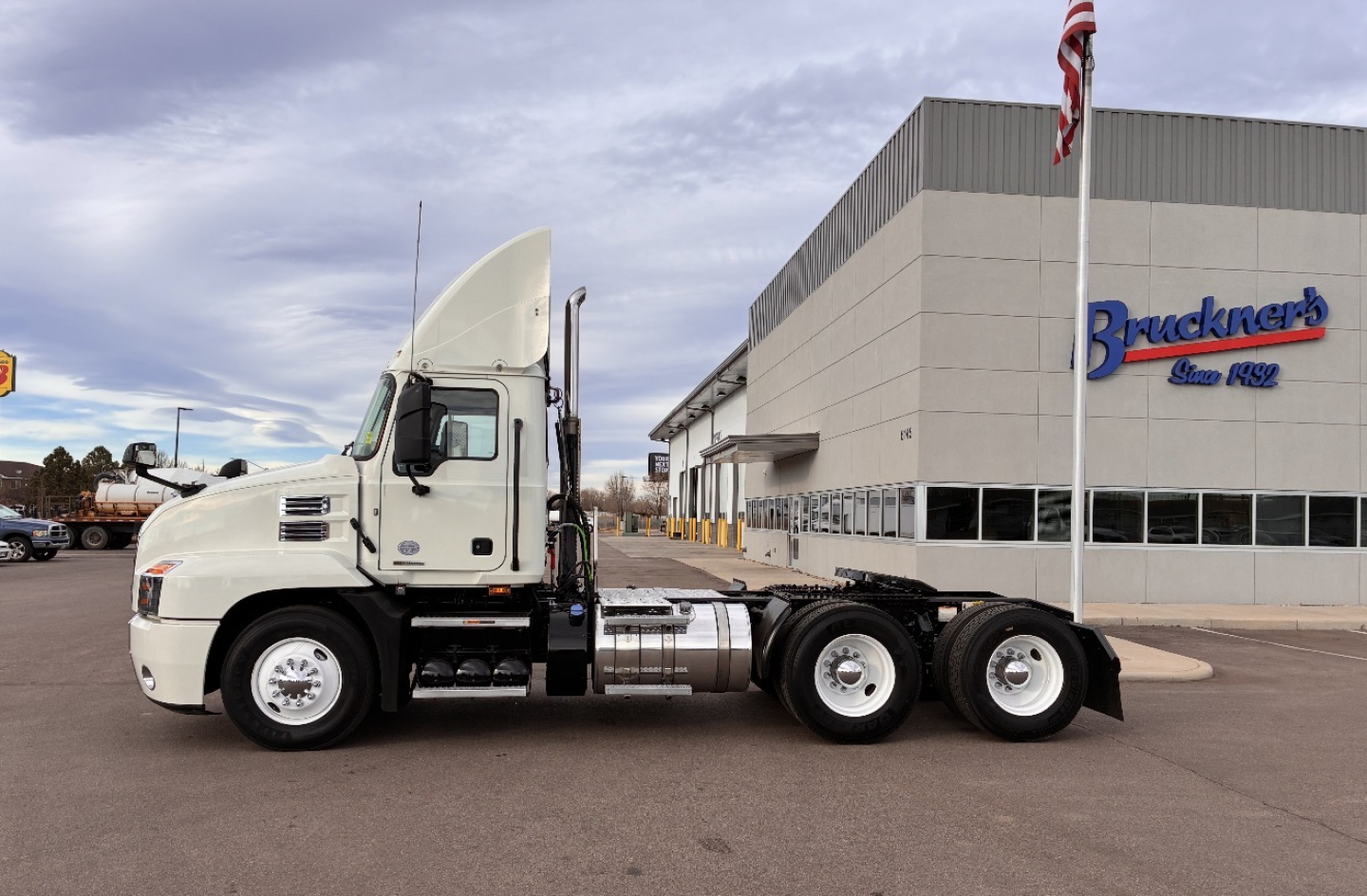 Truck chassis with sleeper cab showing Mack AN64T specification in side view.
