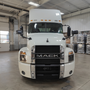 Mack AN64T conventional daycab truck front view showing grille with MACK logo and headlights.