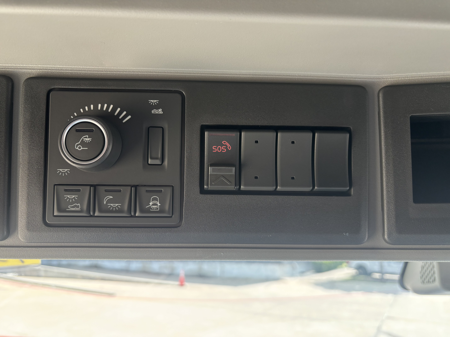 Volvo VNL interior control panel showing climate and auxiliary switches