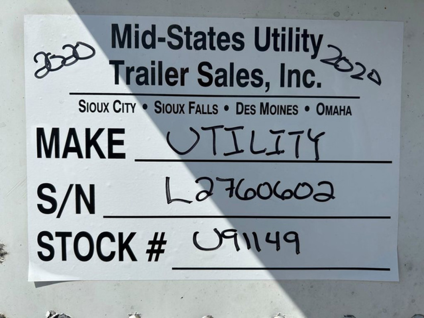 Trailer sign showing Mid-States Utility Trailer Sales, Inc. with Make: Utility, S/N L2760602, Stock # U91149.