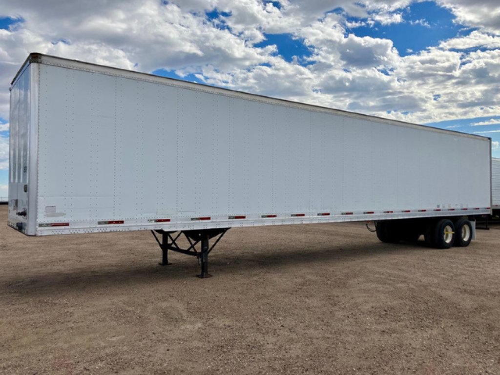 Trailer side view of a white 2007 Trailmobile dry van trailer with tandem axles, no markings visible.