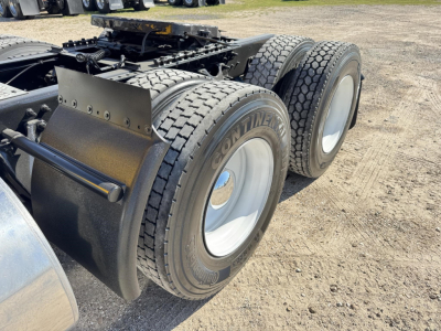 Dual rear axles with Goodyear tires on a 2019 International LT truck chassis showing fifth wheel area and frame rails.