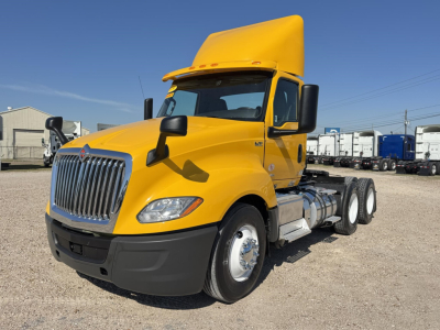 Truck image: 2019 International LT daycab tractor in yellow, front-left view, with fuel tanks and dual rear axles visible.