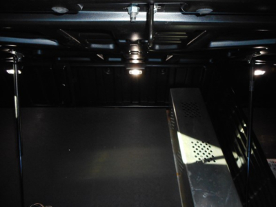 Freightliner Cascadia truck interior indicating under dashboard with metal framework and wiring visible.