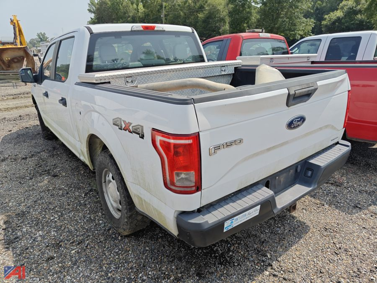 Ford F-150 pickup truck crew cab 4x4 rear view showing bed and tailgate with F-150 badge and 4x4 decal