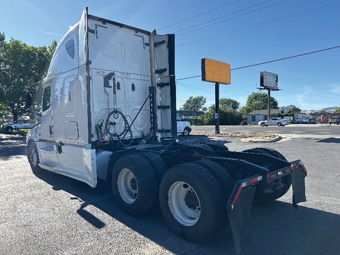 Freightliner Cascadia126 tractor cab and rear wheels showing sleeper configuration and chassis.