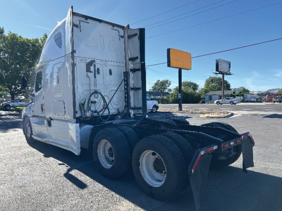 Freightliner Cascadia126 tractor cab and rear wheels showing sleeper configuration and chassis.