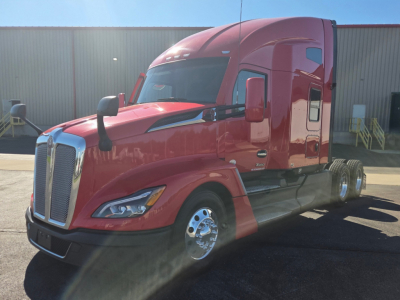 Kenworth T680 conventional sleeper truck in red, front-left view, with chrome grille, dual rear wheels, and extended cab.