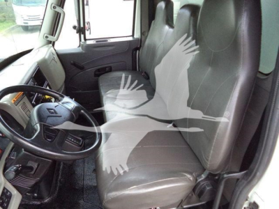 Cab interior of a 2019 International 4300 truck showing driver and passenger seats and steering wheel.