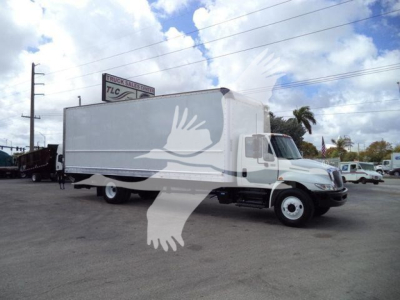 Box truck from a side view of a 2019 International 4300 with a white cargo box and cab, VIN visible in listing, stock number T86297.