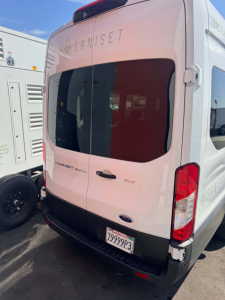 Ford Transit 350 HD XLT rear view showing cargo doors and taillights, Saniset branding on rear window, California license plate 79999P3.