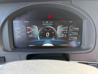 Dashboard display of a Kenworth T880S instrument cluster showing speedometer at 0, multiple gauges with labels such as fuel, oil temp, coolant, and trip information.