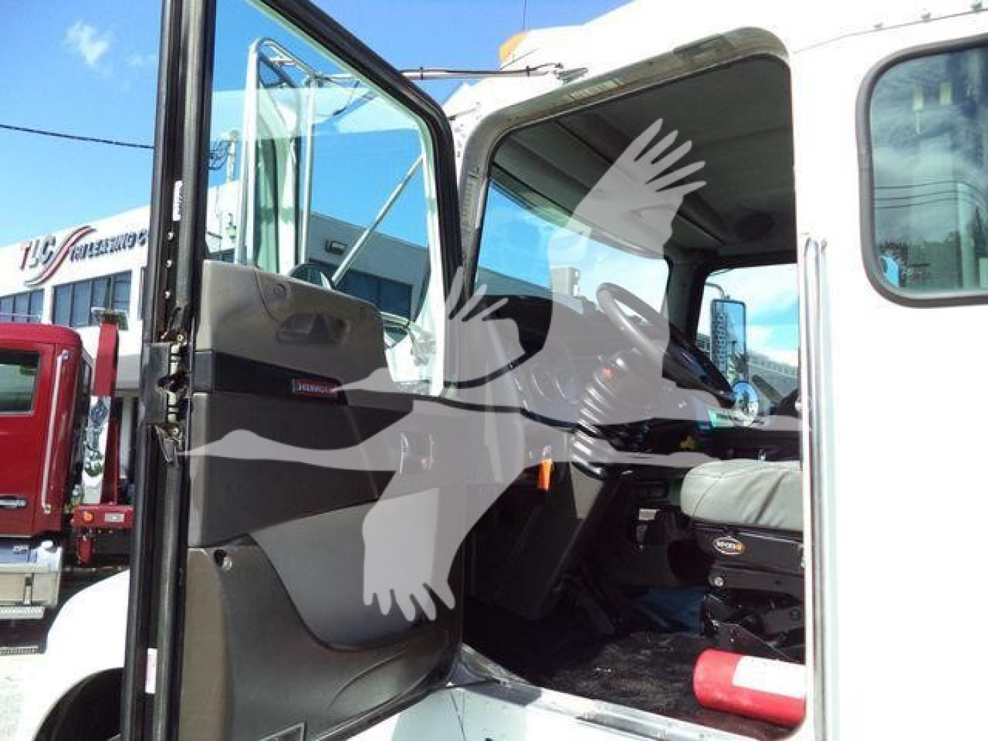 Kenworth T270 interior with open driver door showing steering wheel and seat area.