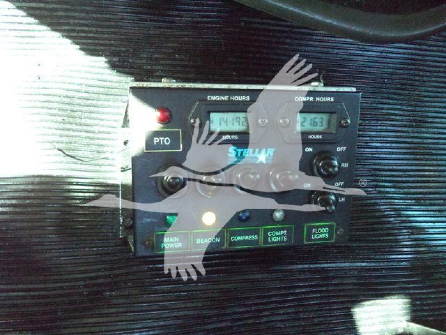 Kenworth T270 engine controls panel showing PTO switch, engine hours and compressor hours readouts, beacon/compressor/flood lights indicators, and main power/beacon/comp lights labels.