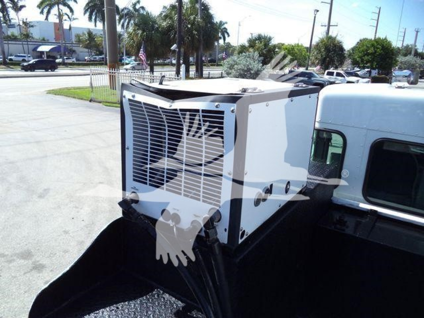 Kenworth T270 service truck cab side with a mounted exterior cooling unit. HVAC/radiator-style grille visible on unit.