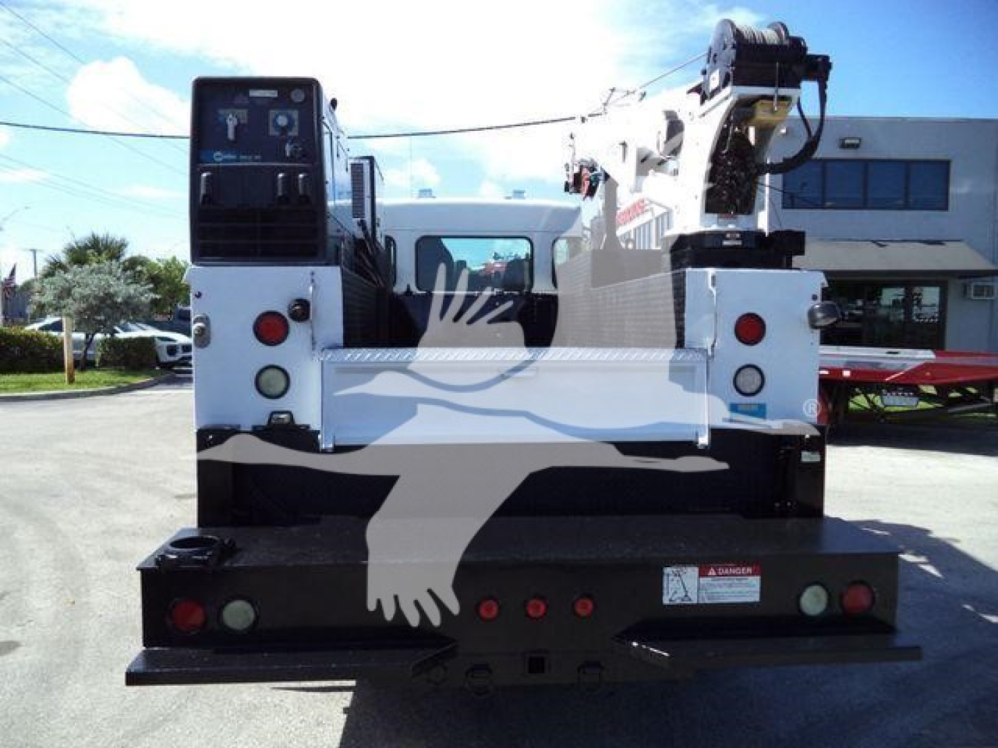 Kenworth T270 service/utility truck rear view with crane on bed chassis and safety lights.