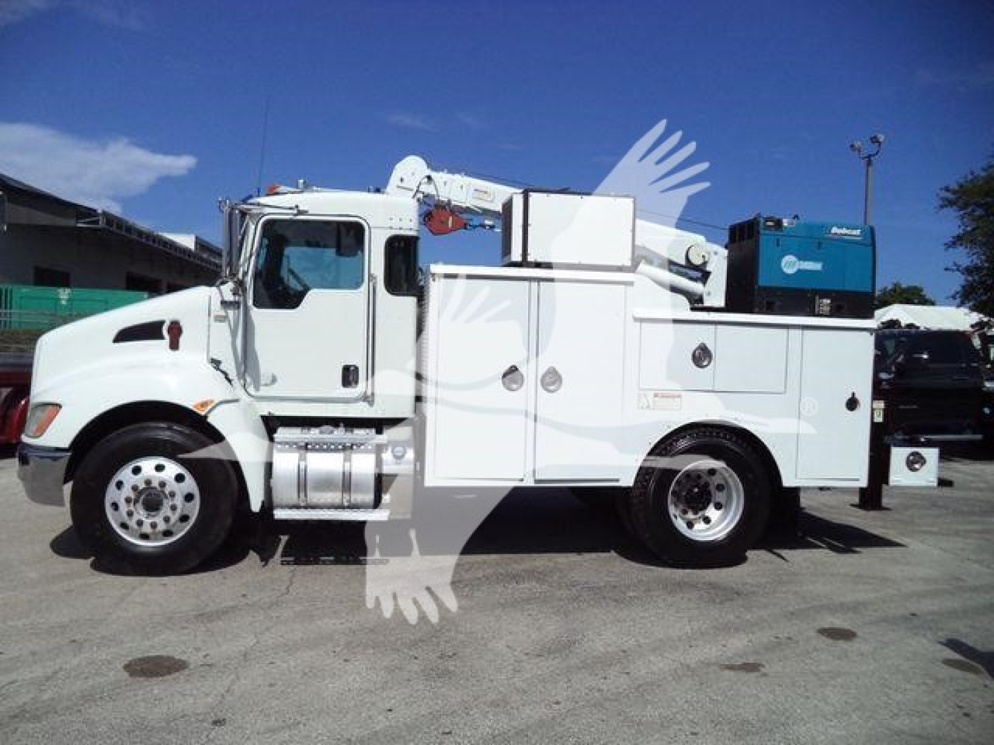 Kenworth T270 service/utilities truck side view with service body and crane in white, showing compartments and equipment mounts.