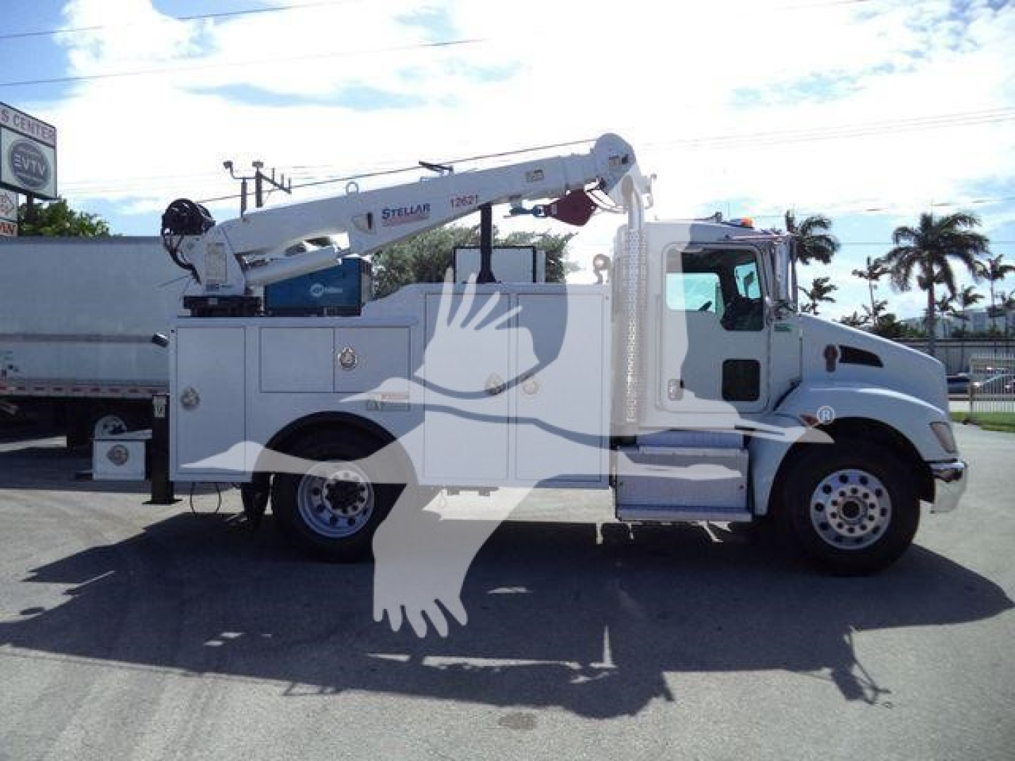 Kenworth T270 utility/service truck with crane boom, side view showing utility body and crane equipment