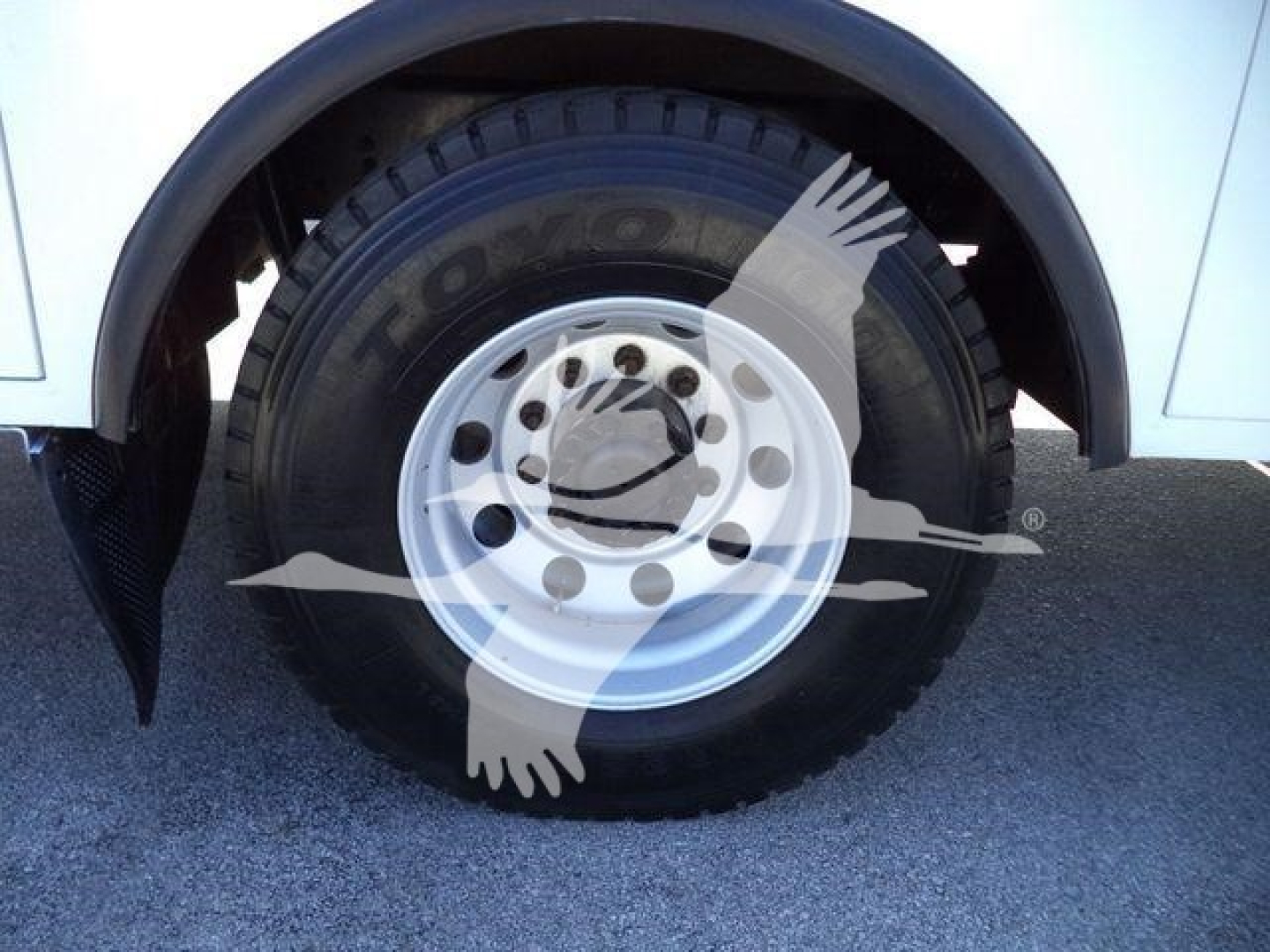 Kenworth T270 wheel and tire close-up showing Toyo tire on white steel rim, front fender and wheel well visible.