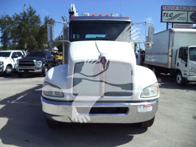 Front view of a white 2016 Kenworth T270 service/utility truck with large grille, chrome bumper, dual mirrors, and cargo area visible in background.