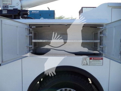 Kenworth T270 service truck bed with open storage, side doors, and warning label visible.