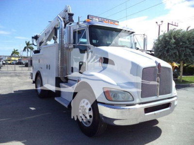 Kenworth service truck with mounted crane in view showing front and passenger side.