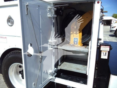 Kenworth T270 service truck cargo area open, showing a yellow telescoping tool or crane inside and a metal shelf in the cargo bay.