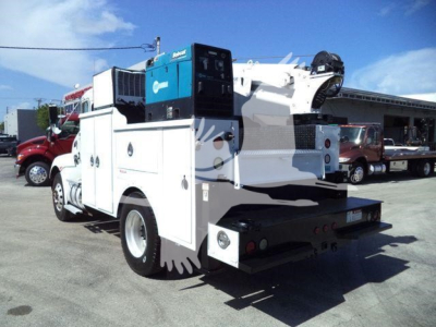 Kenworth T270 service truck rear view showing mounted hydraulic tool storage and crane equipment.