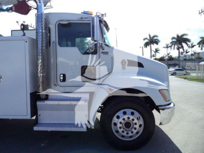 Kenworth T270 service truck side view showing cab and front wheel well with chrome steps and utility compartments.