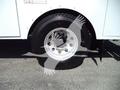 Kenworth T270 wheel and fender showing front tire and wheel well.
