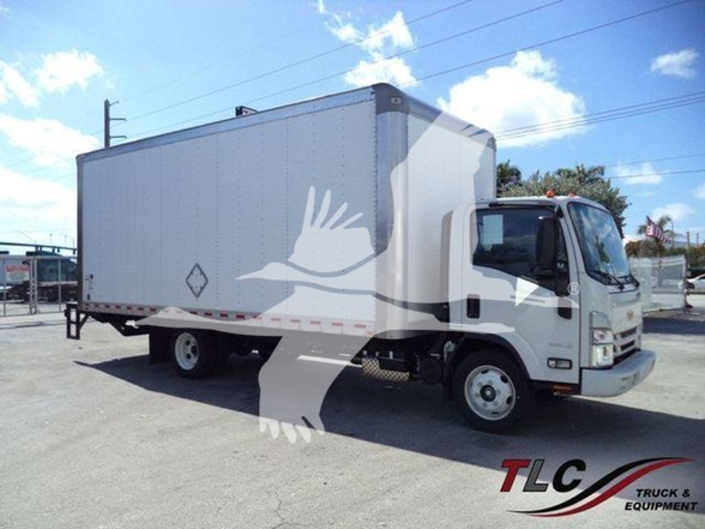 Isuzu NPR box truck showing cargo box and cab; front right side visible; stock decal and equipment markings.