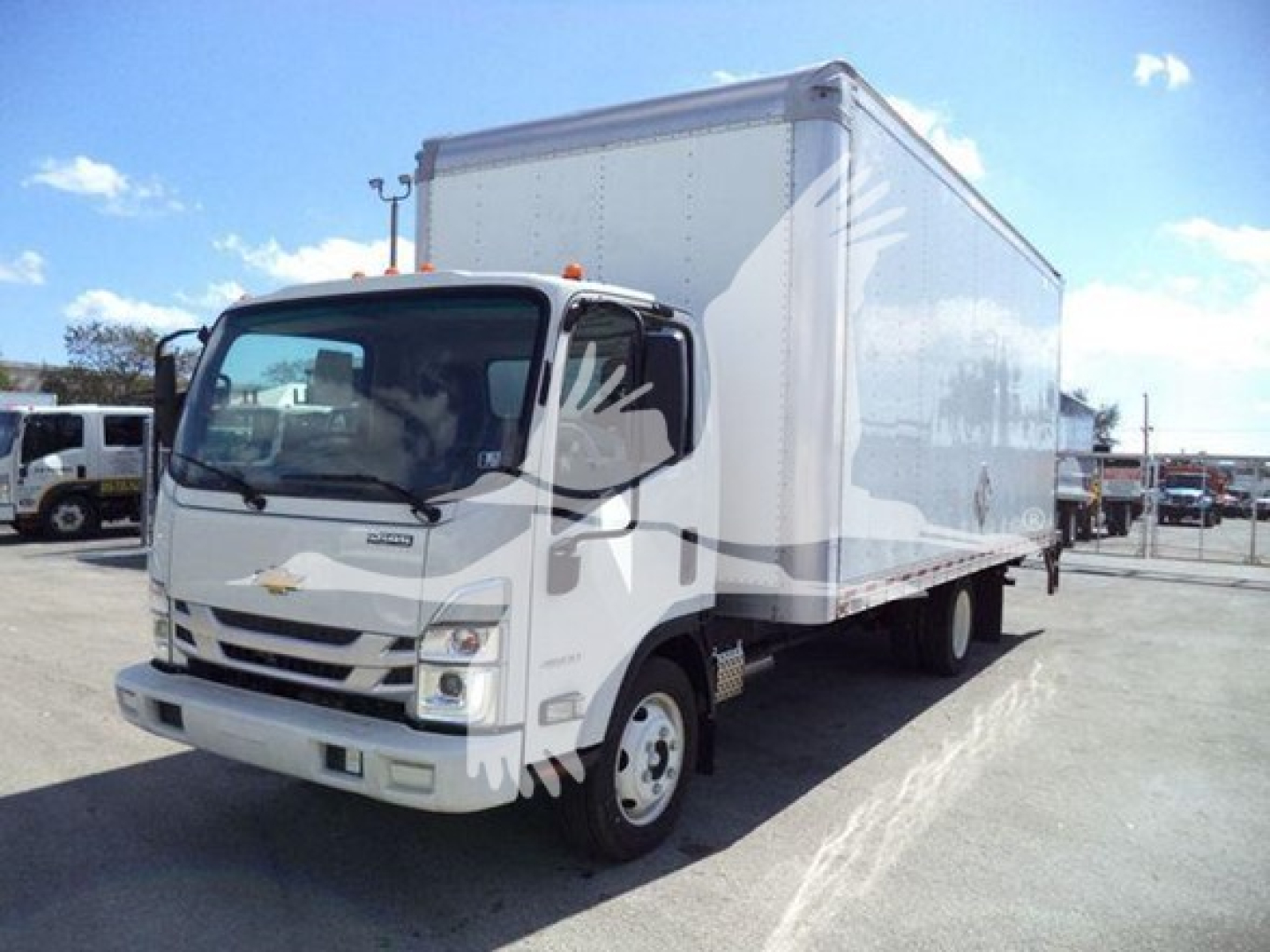 Isuzu NPR box truck showing cab and large rectangular cargo box.