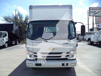 Front view of a white 2023 Isuzu NPR box truck showing Chevrolet-style grille and bumper, large windshield, two side mirrors, and box cargo area.