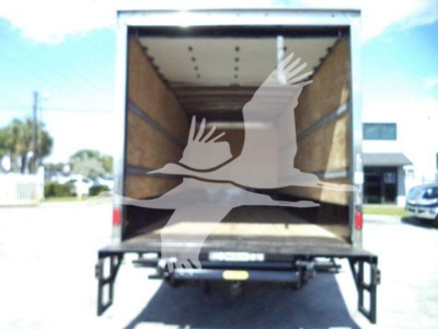 Isuzu NPR box truck rear view showing empty cargo area with wooden walls and open rear doors.