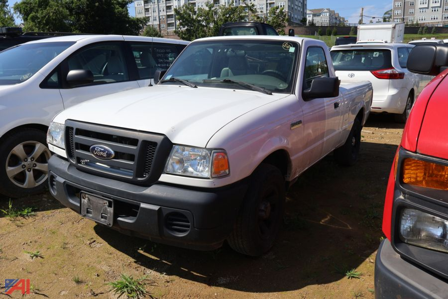Ford Ranger pickup truck 2008 white 2wd with front grille and bumper, parked in a lot among other vehicles.