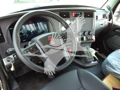 Kenworth T880 interior dashboard and steering wheel with gear shifter area visible.