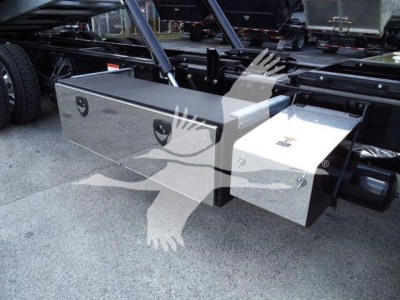 Kenworth T880 rollback truck chassis showing aluminum storage boxes mounted under frame.