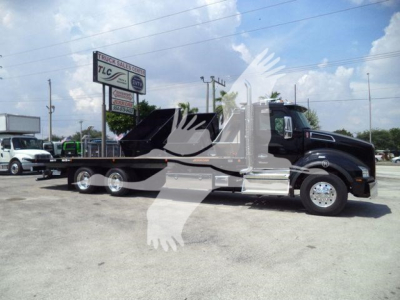 Kenworth T880 rollback truck side view showing extended cab and dump bed with black and silver color scheme.