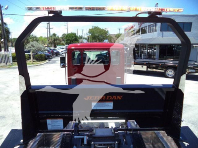 Kenworth T280 rollback truck bed with rear cab window view and metal frame, no visible text on side panels.