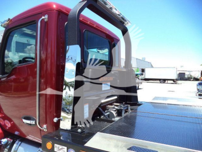 Kenworth T280 rollback truck cab and flatbed area with chrome steps and rear operator rail, maroon cab, metal diamond plate surface.