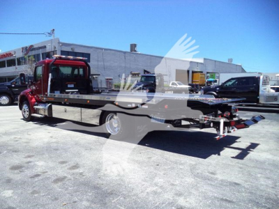 Kenworth T280 rollback truck in service position showing flatbed car carrier with hydraulic winch and wheel-lift setup.