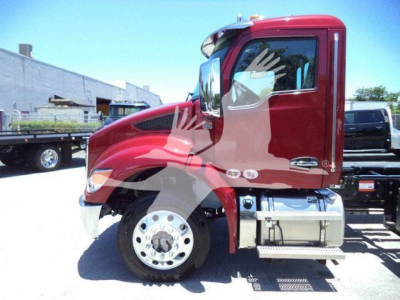 Kenworth T280 rollback truck side view showing cab, front wheel, and chrome fuel tank.