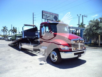 Kenworth T280 rollback truck in red and chrome, front view, with flatbed ramp extended.