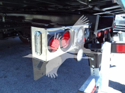 Kenworth T280 rollback truck rear showing tail lights and bumper with chrome housing and reflective tape.