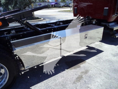 Kenworth T280 rollback truck body side view showing aluminum toolbox with reflective surface