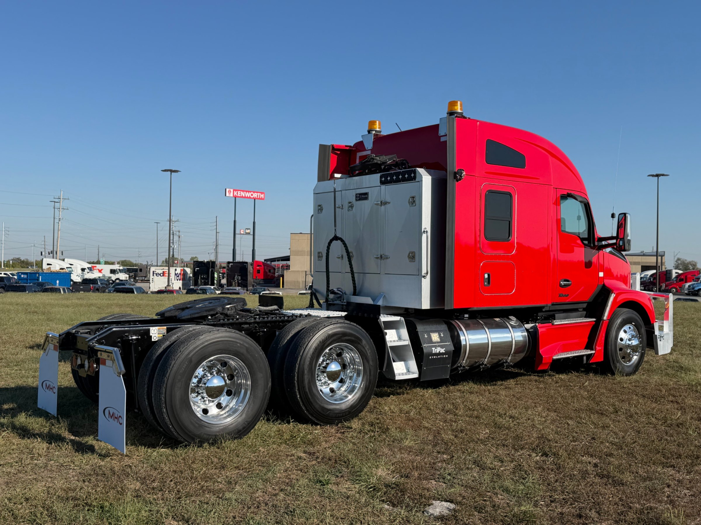 Kenworth T680 2022 conventional sleeper truck shown in red with dual rear axles and chrome wheels, side view, no cab front.