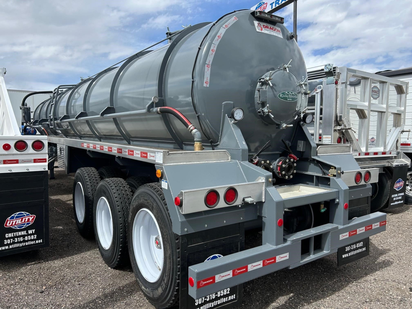 Dragon Vac Tank trailer rear view showing cylindrical tank and rear bumper with lights and stabilizers.