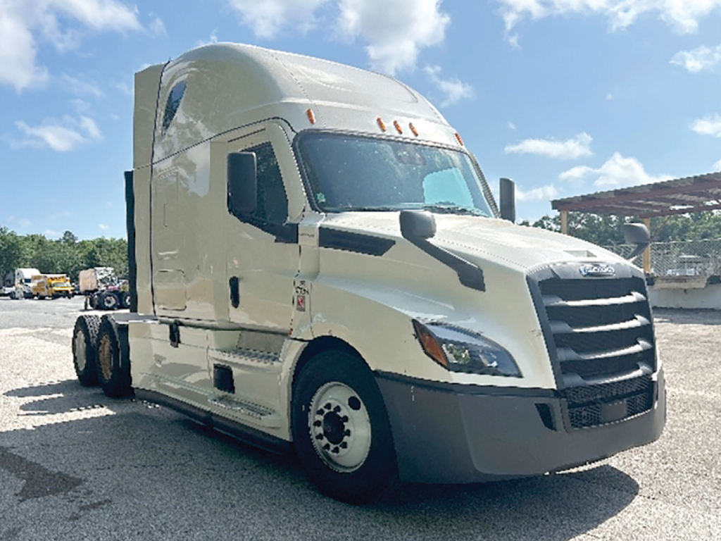 Freightliner Cascadia126 tractor in-view showing sleeper cab and front grille.
